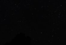 A starry night sky over a mountain