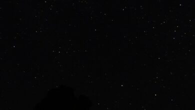 A starry night sky over a mountain