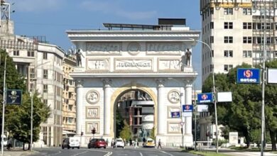 Porta Macedonia triumphal arch lit up at night in Skopje