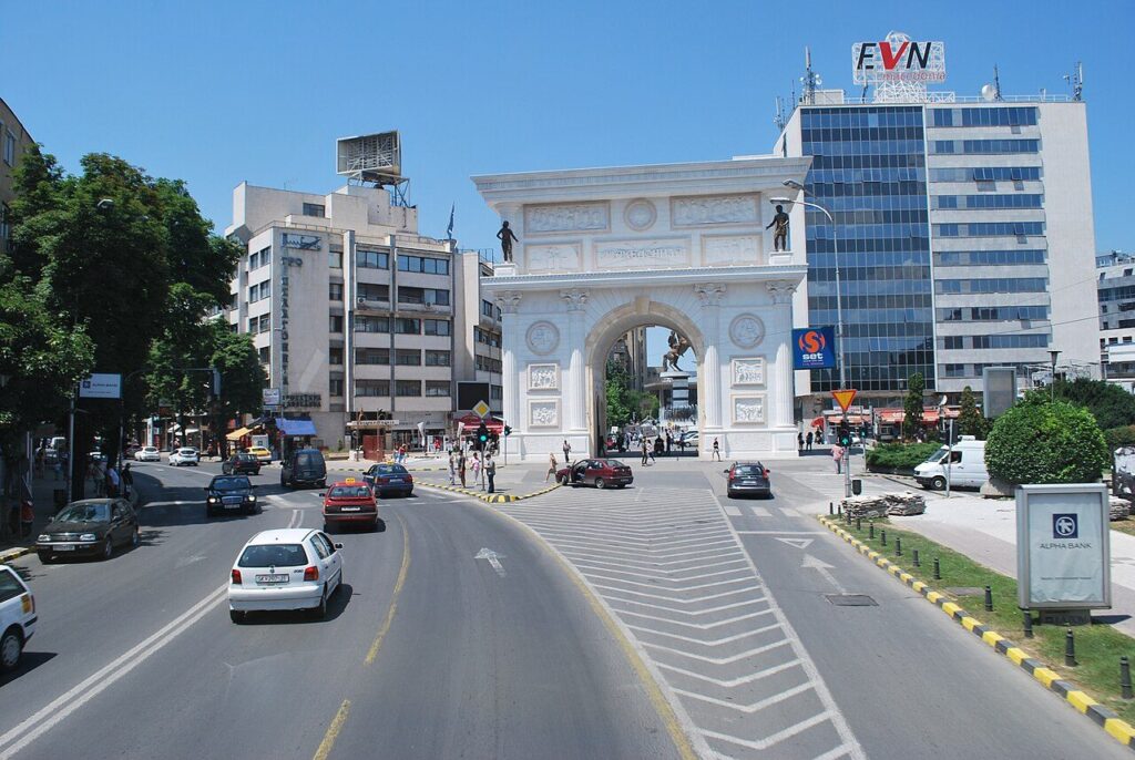 View framed through Porta Macedonia arch on Pella Square, Skopje